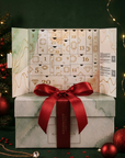 Åpen Gemology adventskalender 2026 på en gaveeske